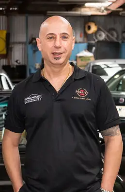 Image of a man in a automotive repair center